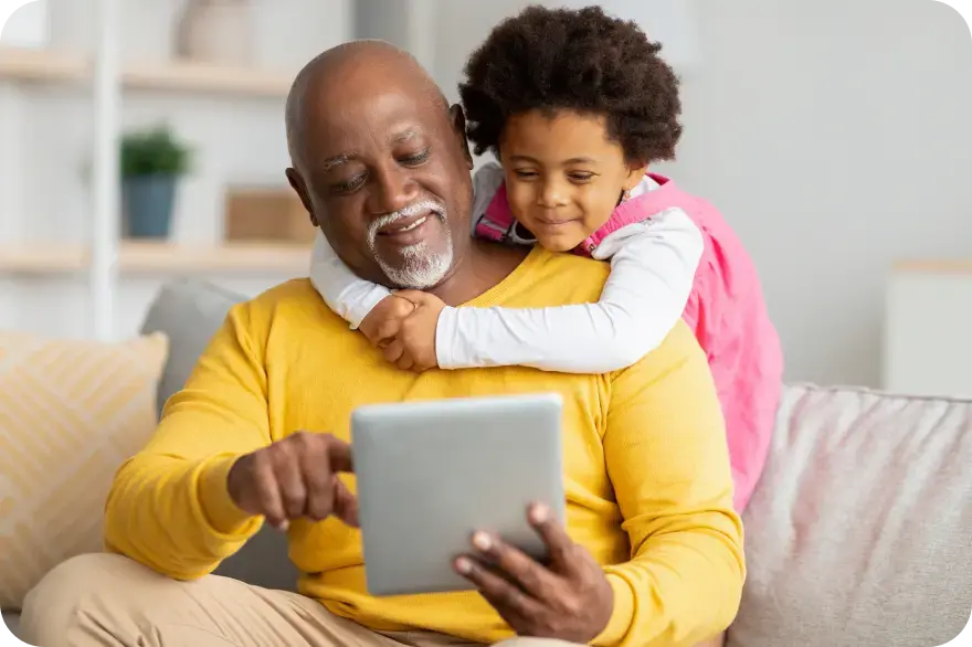 A grandfather and grandchild sharing a moment together